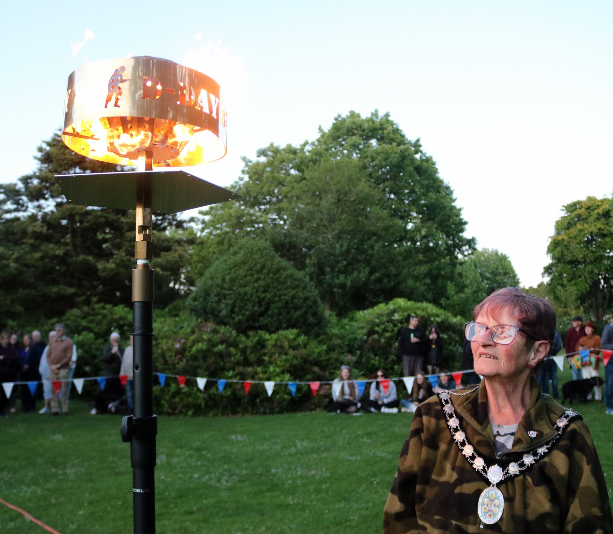 Mayor Janet Lloyd admires the D-Day 80th Anniversary Beacon.