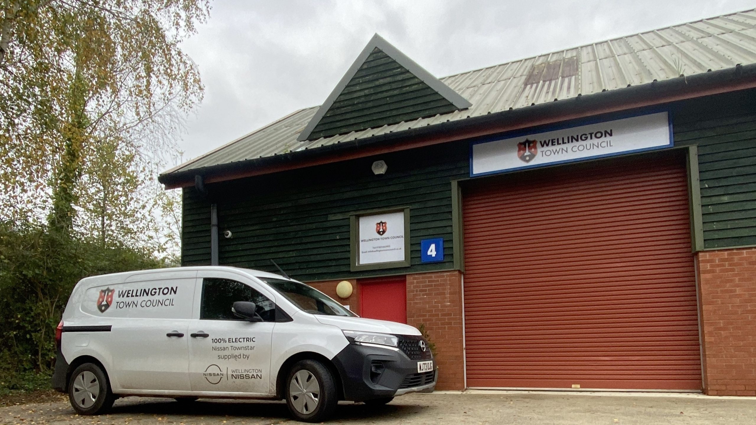 Wellington Town Council branded electric van outside of depot.