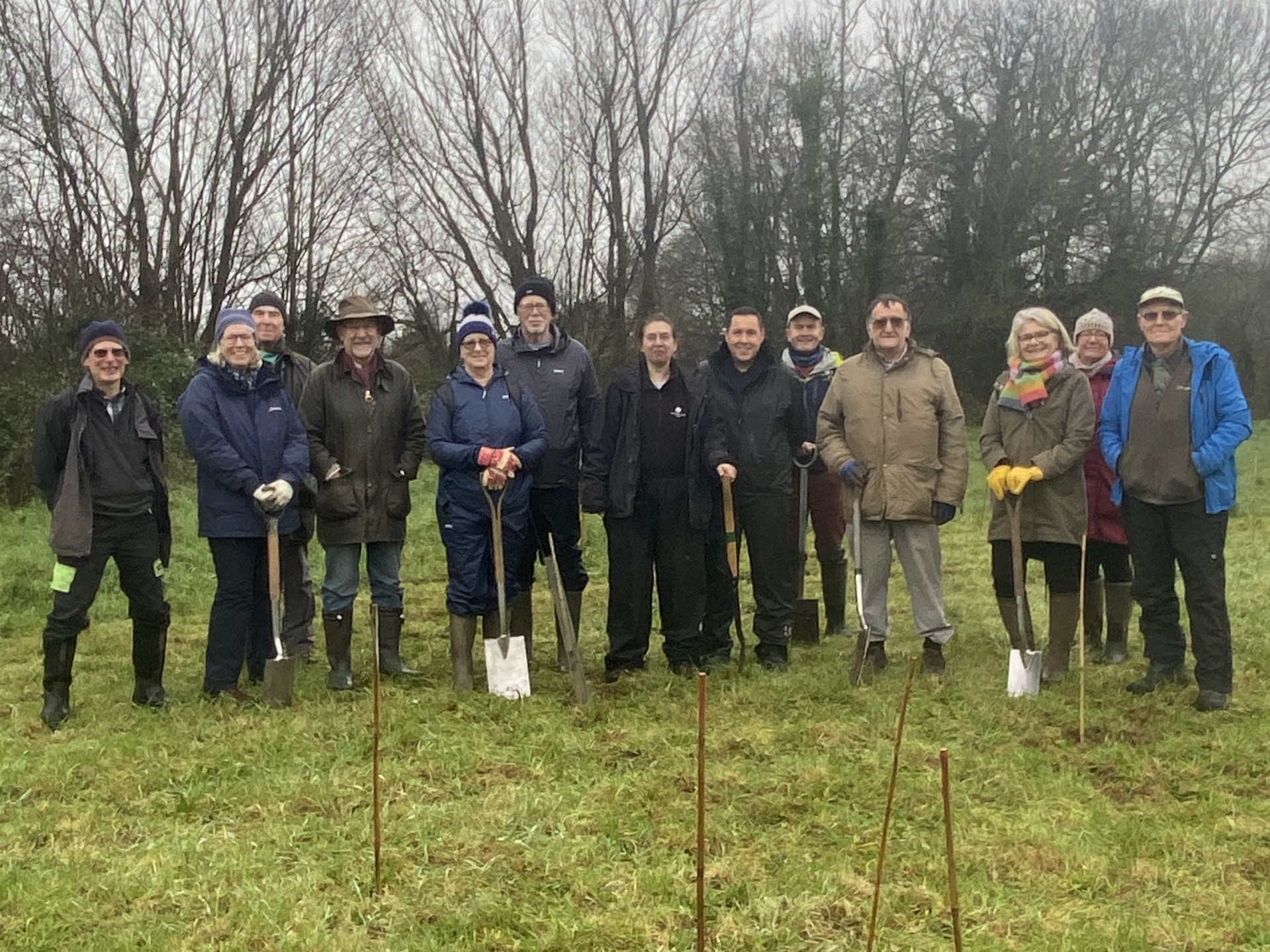 A group of people with spades.