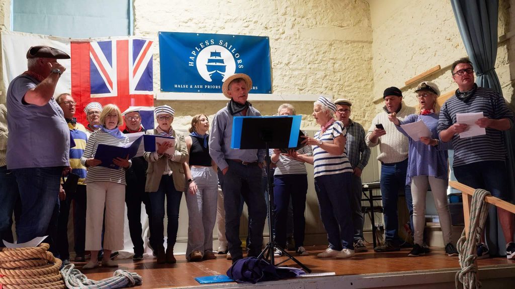 A group of people singing.