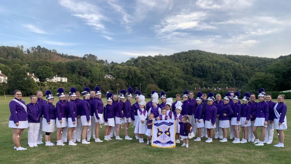 A group of people in purple uniforms.