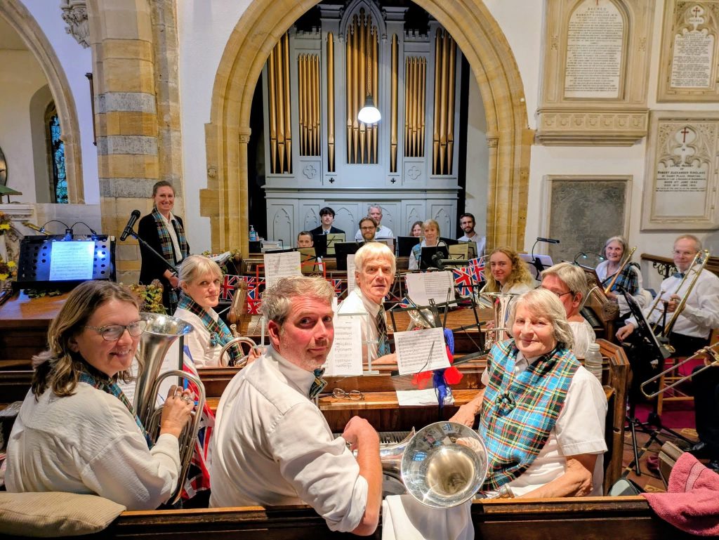 A group of people with instruments in a church.